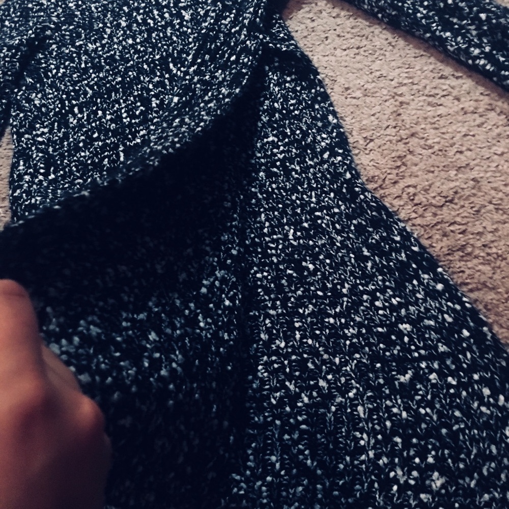 Sweater with a slit up the side.